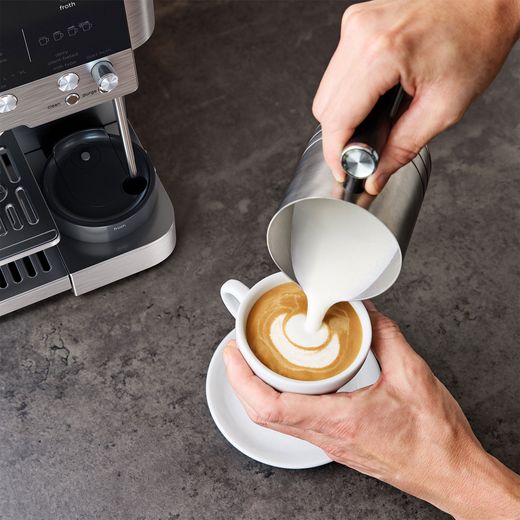 Ninja Luxe Café Premier Espresso Coffee Machine - Black / Stainless Steel -  Person using milk jug