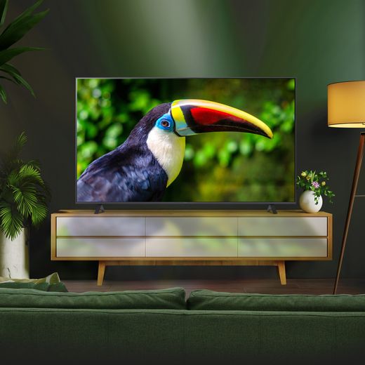 LG UR78 75" 4K Ultra HD Smart TV - TV in living room on tv stand shot