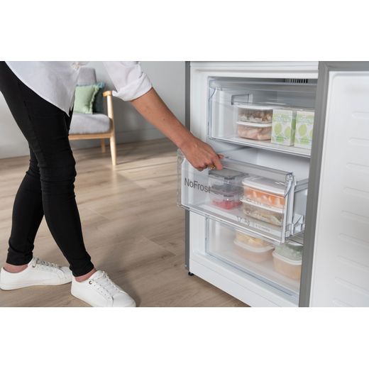 Bosch Series 4 70/30 Frost Free Fridge Freezer - Silver - Person opening freezer drawer shot