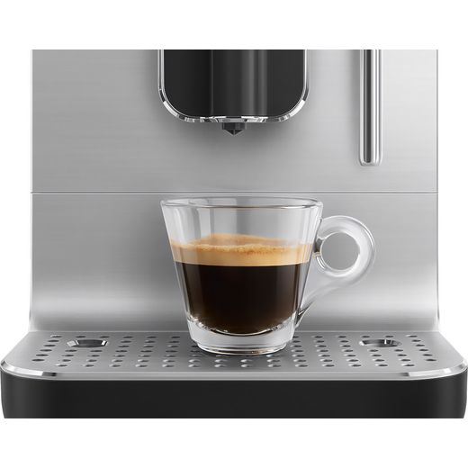 Smeg BCC12BLMUK Coffee Machines Matt Black - Close up of coffee cup on machine shot