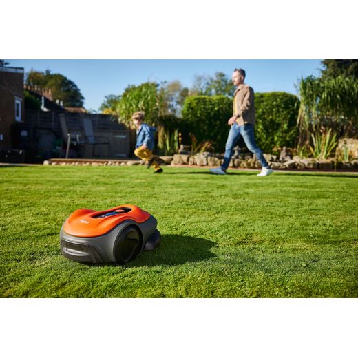 Flymo UltraLife 800 Robotic Lawn Mower - Sunset Orange - lawnmower cutting grass shot