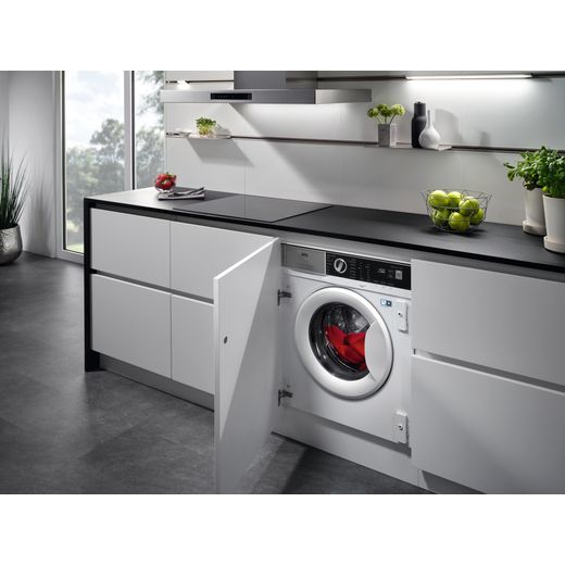 AEG 6000 AutoSense LFX6G7434BI Integrated 9kg Washing Machine with 1400 rpm - White - Washing machine in kitchen cupboard shot