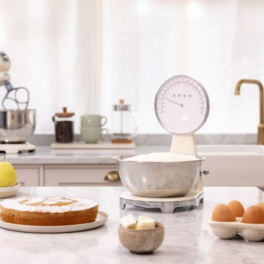 Smeg Retro Kitchen Scales in Cream - Scales being used in kitchen