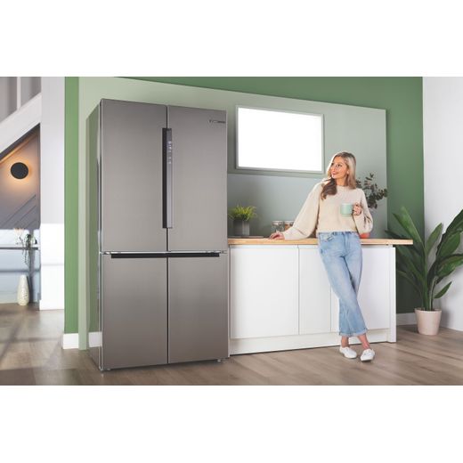 Bosch Series 4 American Fridge Freezer - Stainless Steel Effect - Woman stood next to fridge freezer in kitchen