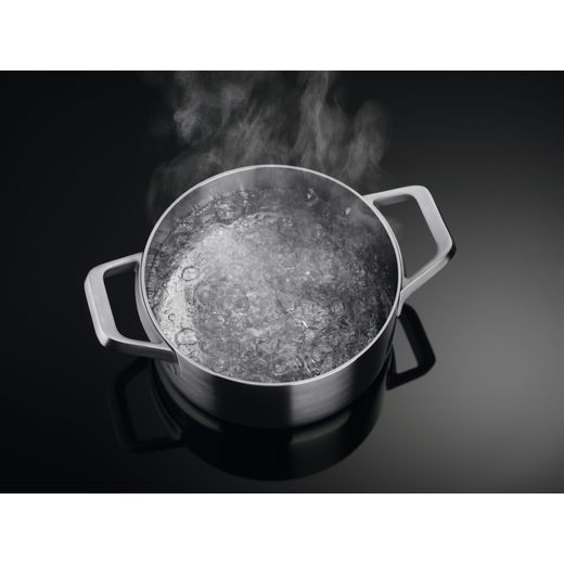 AEG TCH74B01CB 949598097 Induction Hob - Black - Pan on hob shot