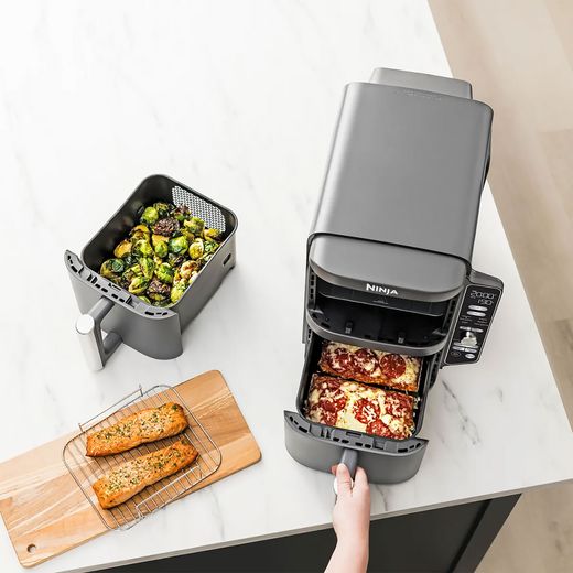 Ninja Foodi Max Dual Zone SL400UK - Black - Top view of food perpared on worktop with air fryer bottom drawer open