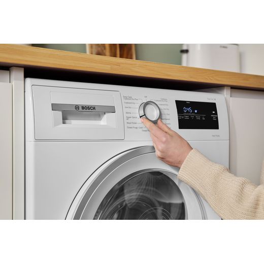 Bosch Series 4 WTH85226GB 8Kg Heat Pump Tumble Dryer - White  - person suing control panel shot