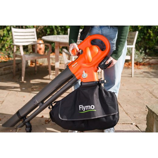 Flymo 9707657-01 Leaf Blower and Vacuum Orange - person using leaf blower shot