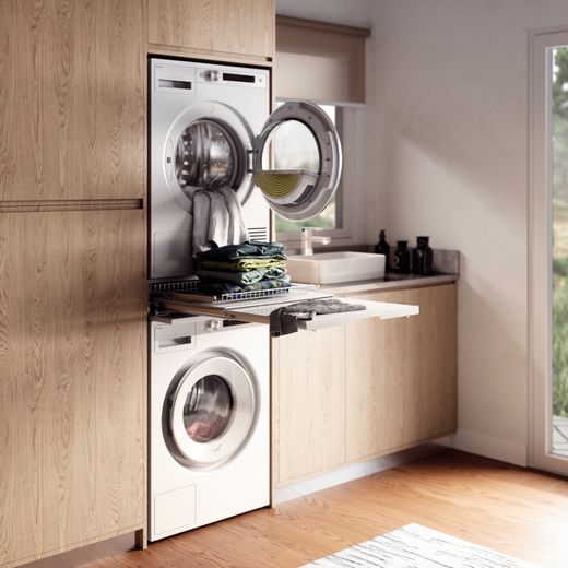 ASKO T509HRW.UK Wifi Connected 9Kg Heat Pump Tumble Dryer - White - Washing machine and tumble dryer stacked in laundry room
