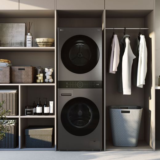 LG WashTower™ AI Direct Drive™ WT1210BBTN1 Wifi Connected 12Kg / 10Kg Heat Pump Washer Dryer with 1400 rpm - Platinum Black - washer dryer in utility room shot