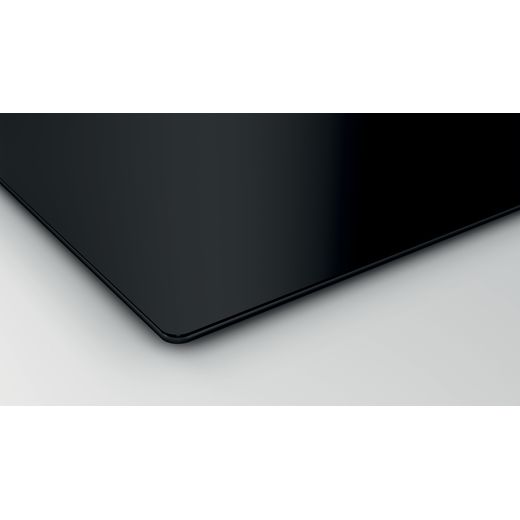Bosch Serie 2 PUG61RAA5B 59cm Induction Hob - Black - Corner of hob and worktop