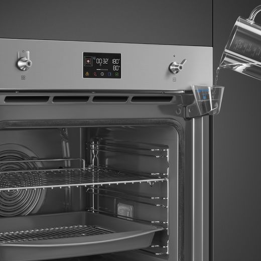 Smeg Classic SteamOne SOP6302S2PX Built In Electric Single Oven - Stainless Steel - Close up person adding water shot