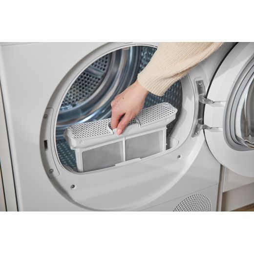 Bosch Series 6 WQH246D9GB 9Kg Heat Pump Tumble Dryer - White - person cleaning filter shot