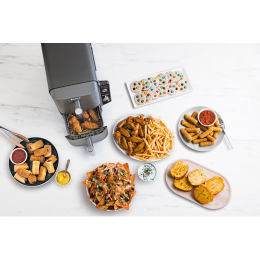 Ninja Foodi Max Dual Zone SL400UK - Black - Food being made with fryer in kitchen shot