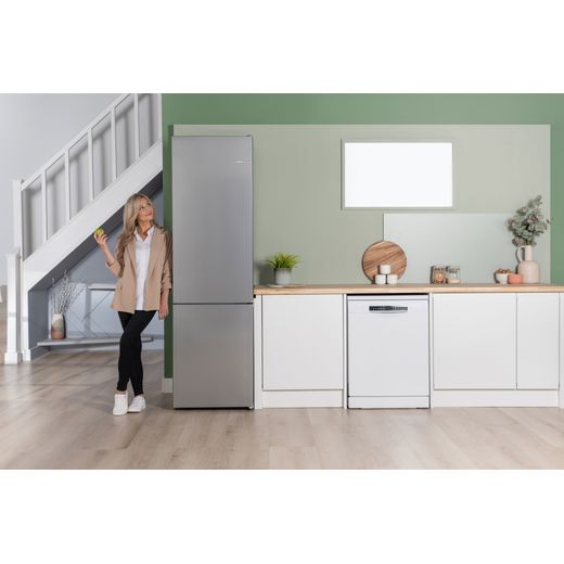 Bosch Series 4 KGN392LAGG 203cm 70/30 Fridge Freezer - Stainless Steel Effect - women next to fridge shot