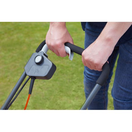 Flymo SimpliMow 320V Corded Lawn Mower - Orange - person using handle shot