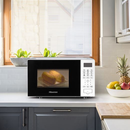 Hisense H20MOWS4UK 20 Litre Microwave - White - microwave in modern kitchen with food inside
