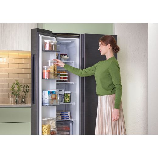 Samsung Series 6 American Fridge Freezer - Black - Woman getting item from fridge