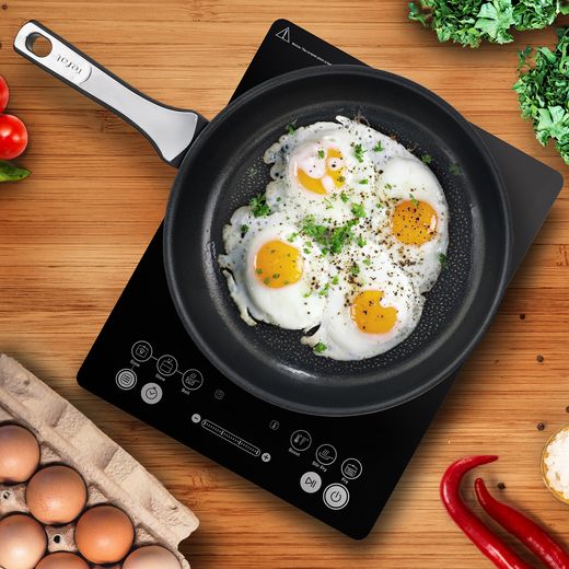 Tefal IH2108G1 Induction Hob - Black - Top view pan frying egg on hob