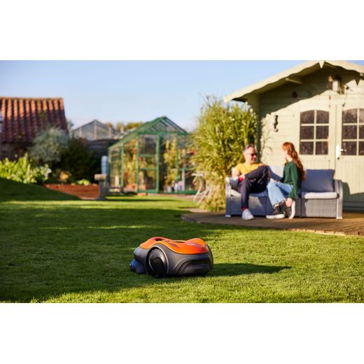 Flymo UltraLife 800 Robotic Lawn Mower - Sunset Orange - lawnmower in garden shot