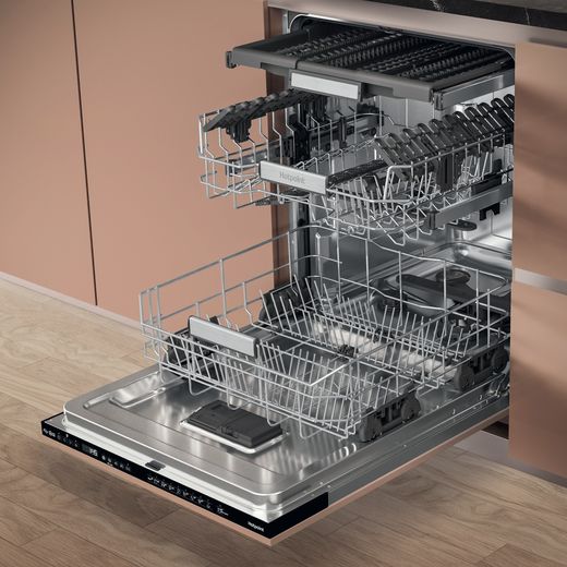 Hotpoint Fully Integrated Standard Dishwasher - Stainless Steel - Trays open in dishwasher in kitchen shot