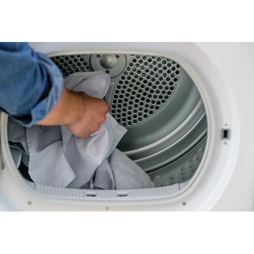 Hoover H-DRY 350 9Kg Condenser Tumble Dryer - White - Person getting washing out of machine shot