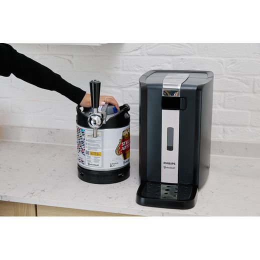 PerfectDraft Draft Beer Dispenser - lifestyle - machine next to keg with dispenser with woman's arm on keg