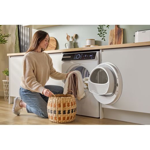 Bosch Series 8 WRB247C9GB 9Kg Heat Pump Tumble Dryer - White - women loading washing machine