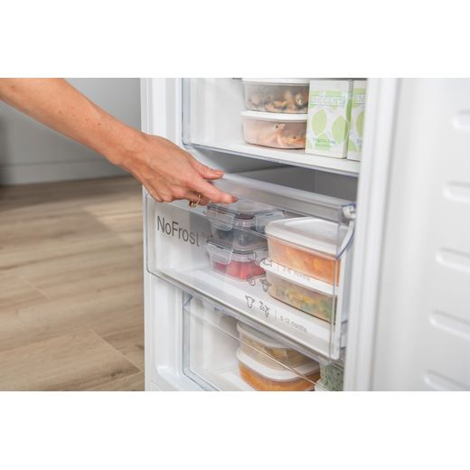 Bosch Series 4 70/30 Frost Free Fridge Freezer - White  - Person opening freezer shot