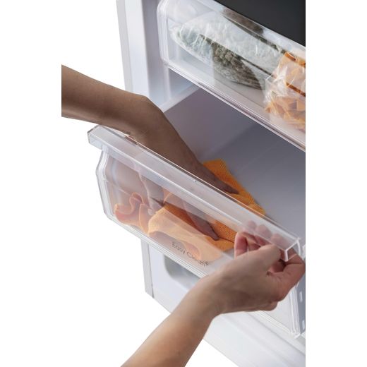 Candy CCG1L314EWK 144cm Small Fridge - White - Person using freezer shot