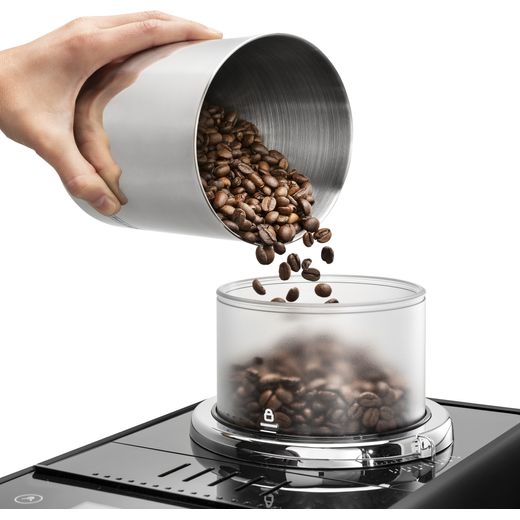 De'Longhi EXAM440.55.B Coffee Machines Black - Person pouring coffee beans in to container shot