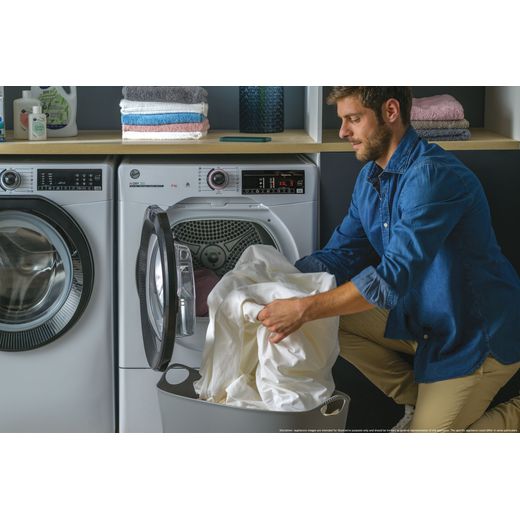 Hoover H-DRY 350 HRE H10N2TBE-80 Wifi Connected 10Kg Heat Pump Tumble Dryer - White - Person filling machine shot