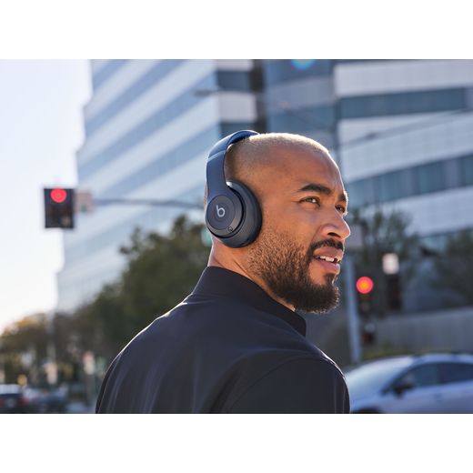 Beats Headphones - Navy - Man wearing headphones outside