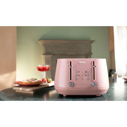 De'Longhi Eclettica CTY4003.PK 4 Slice Toaster - Pink - Toaster on table with food shot