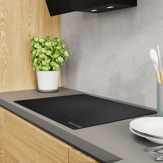 Bosch Series 4 PIE61ABB5E 59cm Induction Hob - - lifestyle - low angled view of hob in kitchen