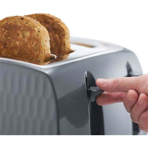 Russell Hobbs Honeycomb 26073 4 Slice Toaster - Grey - Person using toaster shot