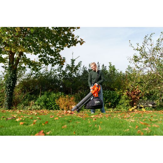 Flymo 9707657-01 Leaf Blower and Vacuum Orange - person using leaf blower shot
