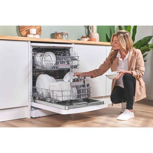 Bosch Series 4 Standard Dishwasher - White - Woman filling dishwasher