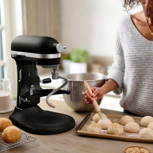 KitchenAid Artisan 5KSM60SPXBBM - Matte Black - Woman using mixer in kitchen