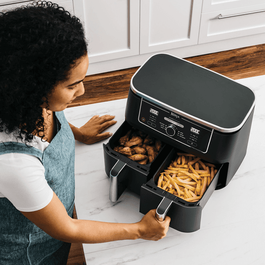 Ninja Foodi Max Dual Zone AF400UK Air Fryer - Black - Women using ninja air fryer shot