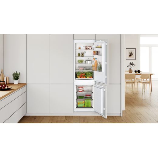 Bosch Integrated Fridge Freezer - White - Fridge freezer with door open in kitchen shot
