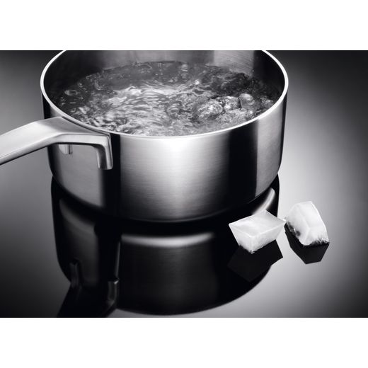 AEG SurroundCook Electric Cooker with - Black - Close up hob on pan shot