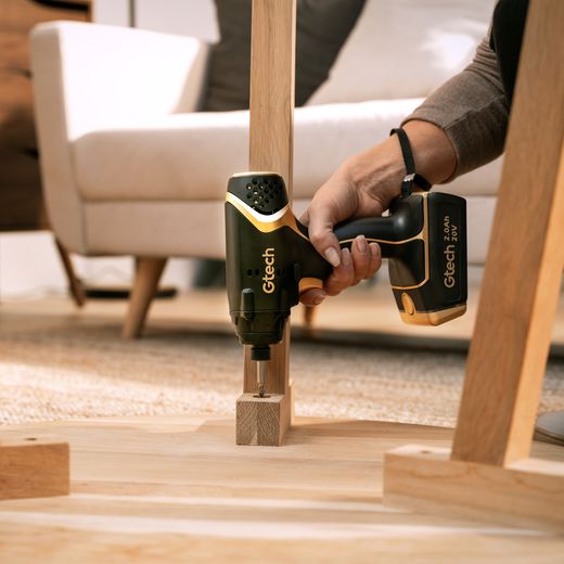 Gtech 1-12-031 Tool Black / Gold - Person using drill