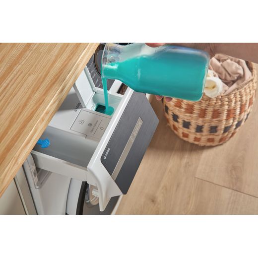 Bosch Series 6 i-Dos WGH254A0GB 10kg WiFi Connected Washing Machine with 1400 rpm - White - person filling up machine shot