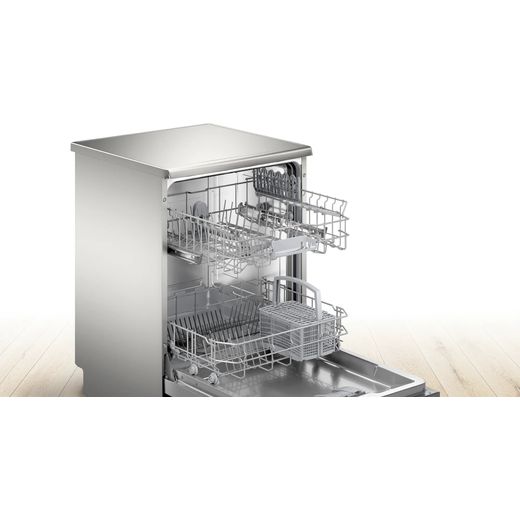 Bosch Standard Dishwasher - Silver - Dishwasher in room with racks out