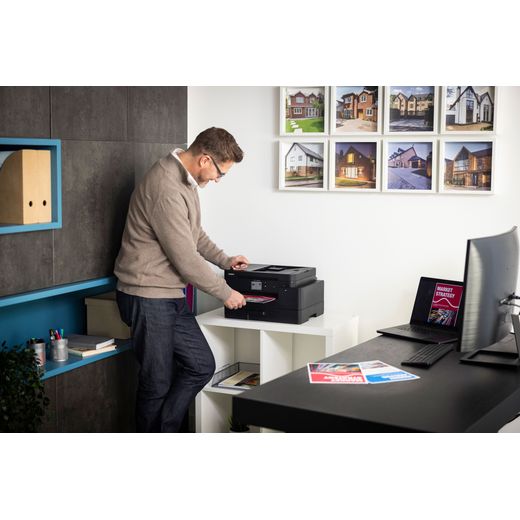 Brother MFC-J4550DW All-in-One Printer - Black - Man using printer