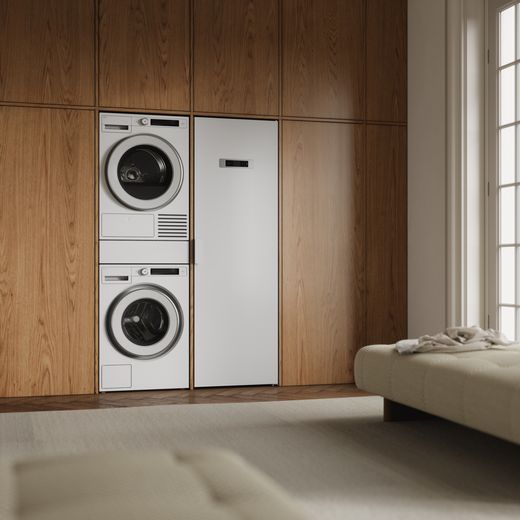 ASKO T509HRW.UK Wifi Connected 9Kg Heat Pump Tumble Dryer - White - Washing machine and tumble dryer stacked in laundry room