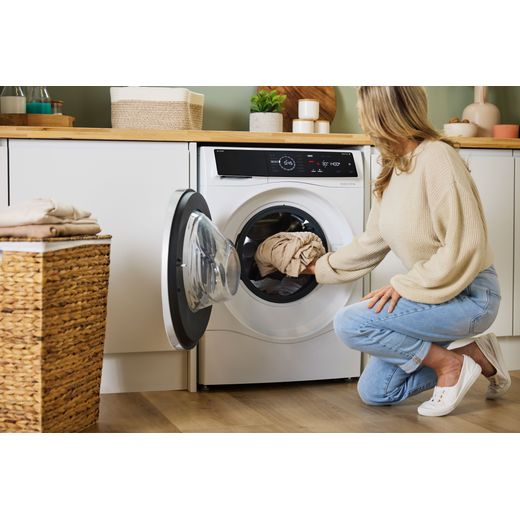 Bosch Series 8 i-Dos 10.5Kg / 6Kg Washer Dryer - White - Women adding clothes to machine