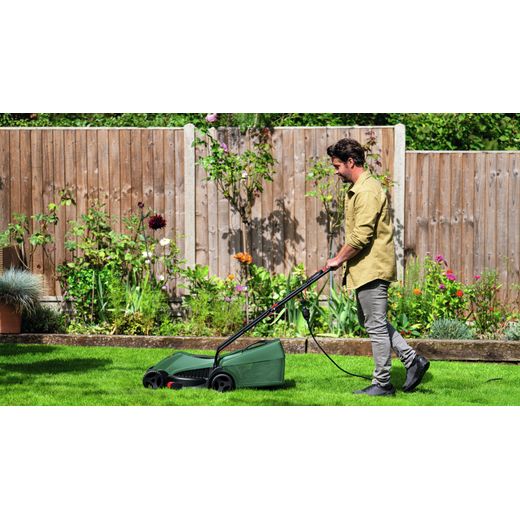 Bosch EASYROTAK 32-225 Lawn Mower Green - Person mowing grass shot