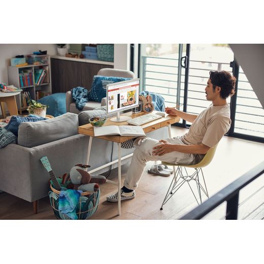 HP 22 -dg0007na 21.45" All in One - Intel Celeron, 128GB UFS - White - Man at office table with desktop shot